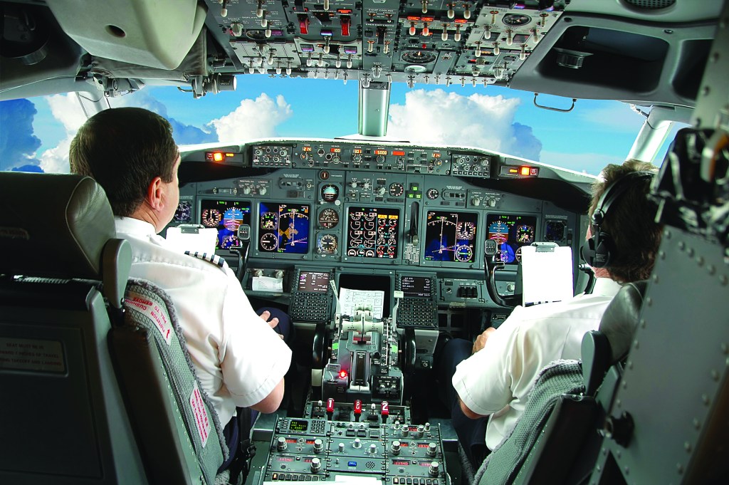 Pilots in the cockpit of an airplane