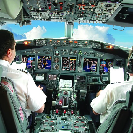Pilots in the cockpit of an airplane