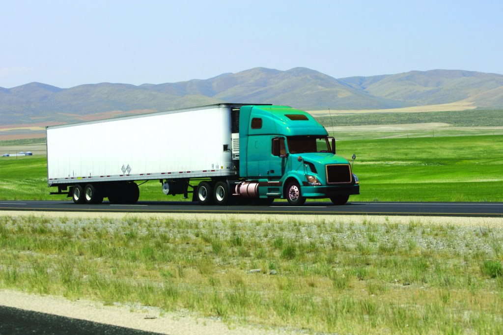 Semi truck traveling done the road