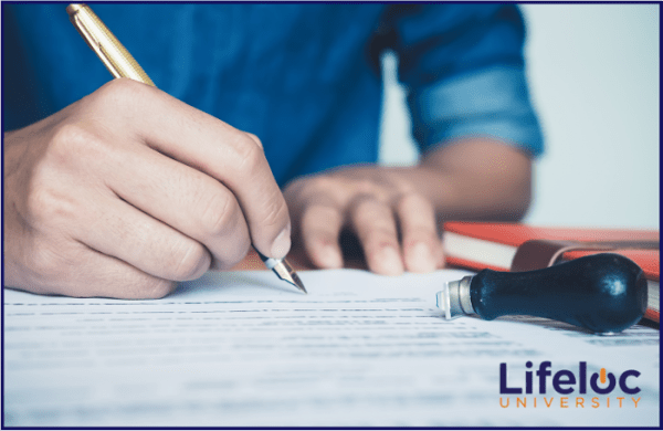 Person filling out employee forms